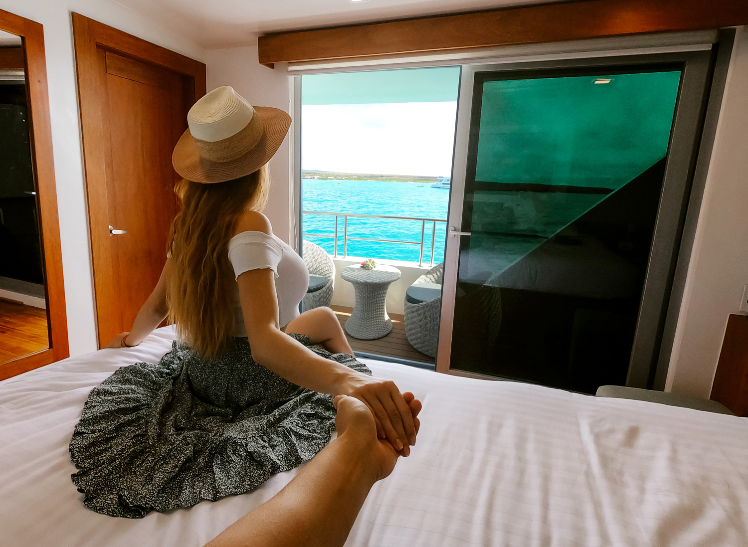Balcony-room-with-woman-looking-out Balcony room with woman looking out